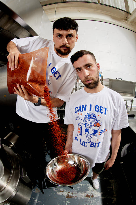 Yep Kitchen employees representing their merch with a fish eye lens 