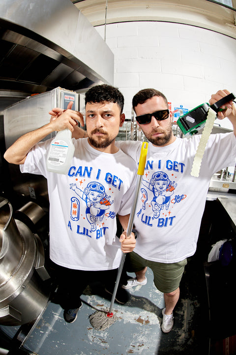 Yep Kitchen employees representing their merch with a fish eye lens 